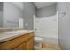 Cozy bathroom featuring a tub, shower, toilet, and vanity with a single sink at 10548 W Crown King Rd, Tolleson, AZ 85353