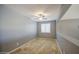 Neutral-toned bedroom showcasing carpet flooring, a ceiling fan, and a window that provides natural light at 10548 W Crown King Rd, Tolleson, AZ 85353