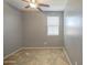 Bedroom featuring carpet floors, neutral colored walls, ceiling fan, and bright window at 10548 W Crown King Rd, Tolleson, AZ 85353