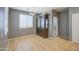 Dining room boasts a classic china cabinet, tile floors, and a large window for natural light at 10548 W Crown King Rd, Tolleson, AZ 85353