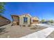 Lovely single-story residence showcasing a two-car garage, desert landscaping, and a cozy front porch at 10548 W Crown King Rd, Tolleson, AZ 85353