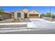 Attractive single-level home boasting a two-car garage, lush front yard, and a welcoming entrance at 10548 W Crown King Rd, Tolleson, AZ 85353