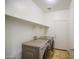 Laundry room featuring a washer and dryer and white walls at 10548 W Crown King Rd, Tolleson, AZ 85353