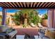 Inviting backyard features lounge seating, a palm tree, and lush landscaping, perfect for relaxation at 10863 N 117Th Pl, Scottsdale, AZ 85259