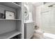Bathroom with open shelves, modern vanity and walk-in shower at 10863 N 117Th Pl, Scottsdale, AZ 85259