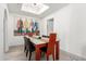 Bright dining room featuring a modern table and chairs and a decorative ceiling fixture at 10863 N 117Th Pl, Scottsdale, AZ 85259