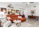 Spacious living room with stylish modern furniture and an adjacent dining area at 10863 N 117Th Pl, Scottsdale, AZ 85259