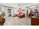 Bright living room featuring modern furnishings, a ceiling fan and an adjacent dining area at 10863 N 117Th Pl, Scottsdale, AZ 85259