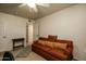 Cozy bedroom featuring a comfortable couch, adjacent to a passageway and a door at 11141 W Cameo Dr, Sun City, AZ 85351