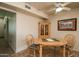 Cozy dining area features a round table with wood chairs at 11141 W Cameo Dr, Sun City, AZ 85351