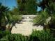 The address for Cameo Palm is displayed on a brick sign surrounded by lush green plants at 11141 W Cameo Dr, Sun City, AZ 85351