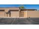 Exterior shot of home featuring a gate and garage door at 11141 W Cameo Dr, Sun City, AZ 85351
