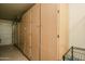 Garage featuring wall-mounted storage cabinets at 11141 W Cameo Dr, Sun City, AZ 85351