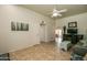 Bright living room featuring tile flooring and open layout at 11141 W Cameo Dr, Sun City, AZ 85351
