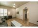 Living room with ceiling fan, neutral paint, tile flooring and comfortable furnishings at 11141 W Cameo Dr, Sun City, AZ 85351