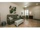 Spacious living room featuring tile flooring and comfortable furnishings at 11141 W Cameo Dr, Sun City, AZ 85351