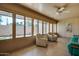 Inviting sun room with ample seating, plenty of light, and view of the outdoors at 11141 W Cameo Dr, Sun City, AZ 85351