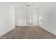 Spacious bedroom with neutral carpet, ceiling fan and bright, natural light from large windows at 11303 E Pratt Ave, Mesa, AZ 85212