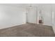 Spacious bedroom leads to bathroom and features neutral walls, carpet and ceiling fan at 11303 E Pratt Ave, Mesa, AZ 85212