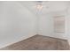 Neutral bedroom with a vaulted ceiling, fan, and window with coverings for natural light at 11303 E Pratt Ave, Mesa, AZ 85212