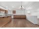 Bright kitchen area with tile flooring, a large island, and plenty of counter space at 11303 E Pratt Ave, Mesa, AZ 85212