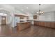 Well-lit kitchen featuring tile floors, an island and lots of counterspace at 11303 E Pratt Ave, Mesa, AZ 85212