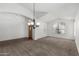 Well-lit living room with vaulted ceilings and a view of the front door at 11303 E Pratt Ave, Mesa, AZ 85212