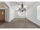 Bright living room with neutral walls, carpet, and vaulted ceilings at 11303 E Pratt Ave, Mesa, AZ 85212