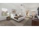 Comfortable main bedroom features large windows, ceiling fan, and attractive decor and furnishings at 11303 E Pratt Ave, Mesa, AZ 85212