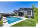 Beautiful backyard oasis showcasing a refreshing pool, patio and lush artificial grass at 13171 W Redstone Dr, Peoria, AZ 85383
