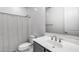 Clean bathroom featuring a shower, toilet, and vanity with sink at 13171 W Redstone Dr, Peoria, AZ 85383