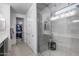 Bathroom featuring a large shower with glass door and a view to the walk-in closet at 13171 W Redstone Dr, Peoria, AZ 85383