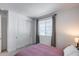Bright bedroom features a sliding closet door and a large window for ample natural light at 13171 W Redstone Dr, Peoria, AZ 85383