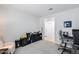 Bright bedroom with neutral walls and carpeting can be easily adapted to any use at 13171 W Redstone Dr, Peoria, AZ 85383