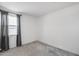 Empty bedroom featuring plush carpeting, neutral walls, and a large window at 13171 W Redstone Dr, Peoria, AZ 85383