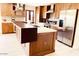 Modern kitchen with stainless steel appliances and custom wood cabinetry at 133 W Balboa Dr, Tempe, AZ 85282
