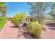 Well-maintained backyard with desert landscaping and a covered patio area at 13444 W Cabrillo Dr, Sun City West, AZ 85375