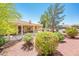 Well-maintained backyard with desert landscaping and a covered patio area at 13444 W Cabrillo Dr, Sun City West, AZ 85375
