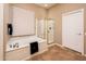 Bright bathroom featuring garden tub, glass shower enclosure, tile flooring, and a neutral color palette at 13444 W Cabrillo Dr, Sun City West, AZ 85375