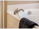 Close-up of a bathtub faucet with a silver finish, set against a white tub surround at 13444 W Cabrillo Dr, Sun City West, AZ 85375