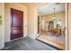 Inviting entrance featuring beautiful wood doors with easy access to the cozy dining area at 13444 W Cabrillo Dr, Sun City West, AZ 85375
