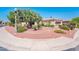 Well-maintained desert landscape with beautiful trees and a well manicured front yard at 13444 W Cabrillo Dr, Sun City West, AZ 85375