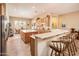Open kitchen with a breakfast bar, ample counter space, and modern appliances, great for entertaining at 13444 W Cabrillo Dr, Sun City West, AZ 85375