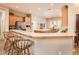 Well-equipped kitchen with breakfast bar, stainless steel appliances, and ample counter space for meal preparation at 13444 W Cabrillo Dr, Sun City West, AZ 85375