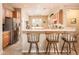 Spacious kitchen featuring a breakfast bar, stainless steel appliances, and an adjacent dining area at 13444 W Cabrillo Dr, Sun City West, AZ 85375