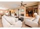 Spacious living room showcasing a fireplace, entertainment center, and open layout ideal for gatherings at 13444 W Cabrillo Dr, Sun City West, AZ 85375