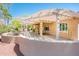 Lovely covered patio with ample space, overlooking the landscaped backyard at 13444 W Cabrillo Dr, Sun City West, AZ 85375