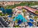 Aerial view of a community showcasing a pool, clubhouse, and surrounding residences with manicured landscaping at 1640 E Augusta Ave, Chandler, AZ 85249