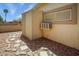 Side yard featuring stone walkway and a storage shed, providing practicality and charm to the property at 1640 E Augusta Ave, Chandler, AZ 85249