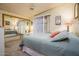 Relaxing bedroom featuring large mirrored closet doors, neutral decor, and a comfortable queen size bed at 1640 E Augusta Ave, Chandler, AZ 85249